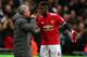 LONDON, ENGLAND - JANUARY 31: Paul Pogba of Manchester United talks with Jose Mourinho, Manager of Manchester United on the sidelines during the Premier League match between Tottenham Hotspur and Manchester United at Wembley Stadium on January 31, 2018 in London, England. (Photo by Chris Brunskill Ltd/Getty Images)