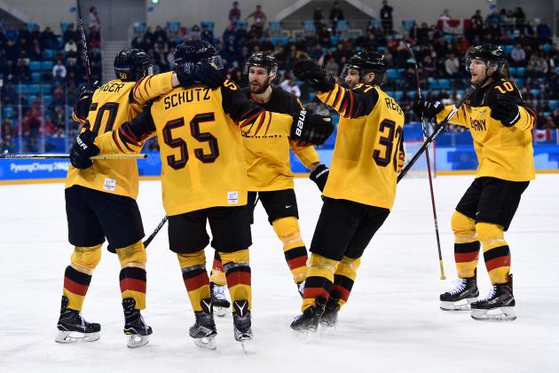 Germany's team celebrates scoring in the men's semi-final ice hockey match between Canada and Germany during the Pyeongchang 2018 Winter Olympic Games at the Gangneung Hockey Centre in Gangneung on February 23, 2018.   / AFP PHOTO / Brendan Smialowski        (Photo credit should read BRENDAN SMIALOWSKI/AFP/Getty Images)