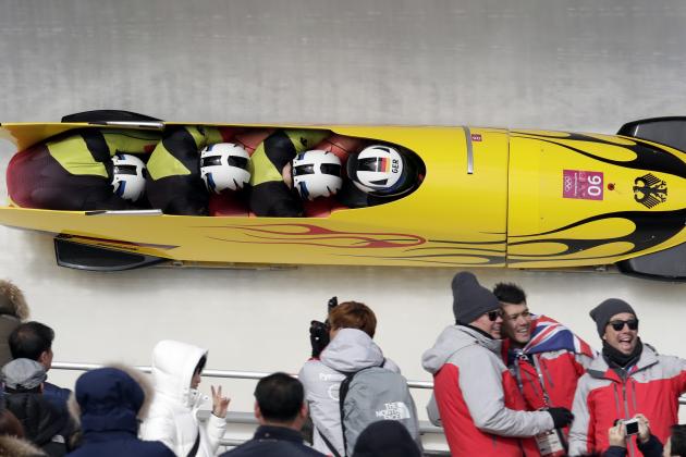 Driver Johannes Lochner, Christian Poser, Christopher Weber and Christian Rasp of Germany take a curve in the second heat of the four-man bobsled competition at the 2018 Winter Olympics in Pyeongchang, South Korea, Saturday, Feb. 24, 2018. (AP Photo/Michael Sohn)