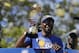 Golden State Warriors' Kevin Durant smiles as he holds the NBA Finals MVP trophy during a parade and rally after winning the NBA basketball championship Thursday, June 15, 2017, in Oakland, Calif. (AP Photo/Marcio Jose Sanchez)