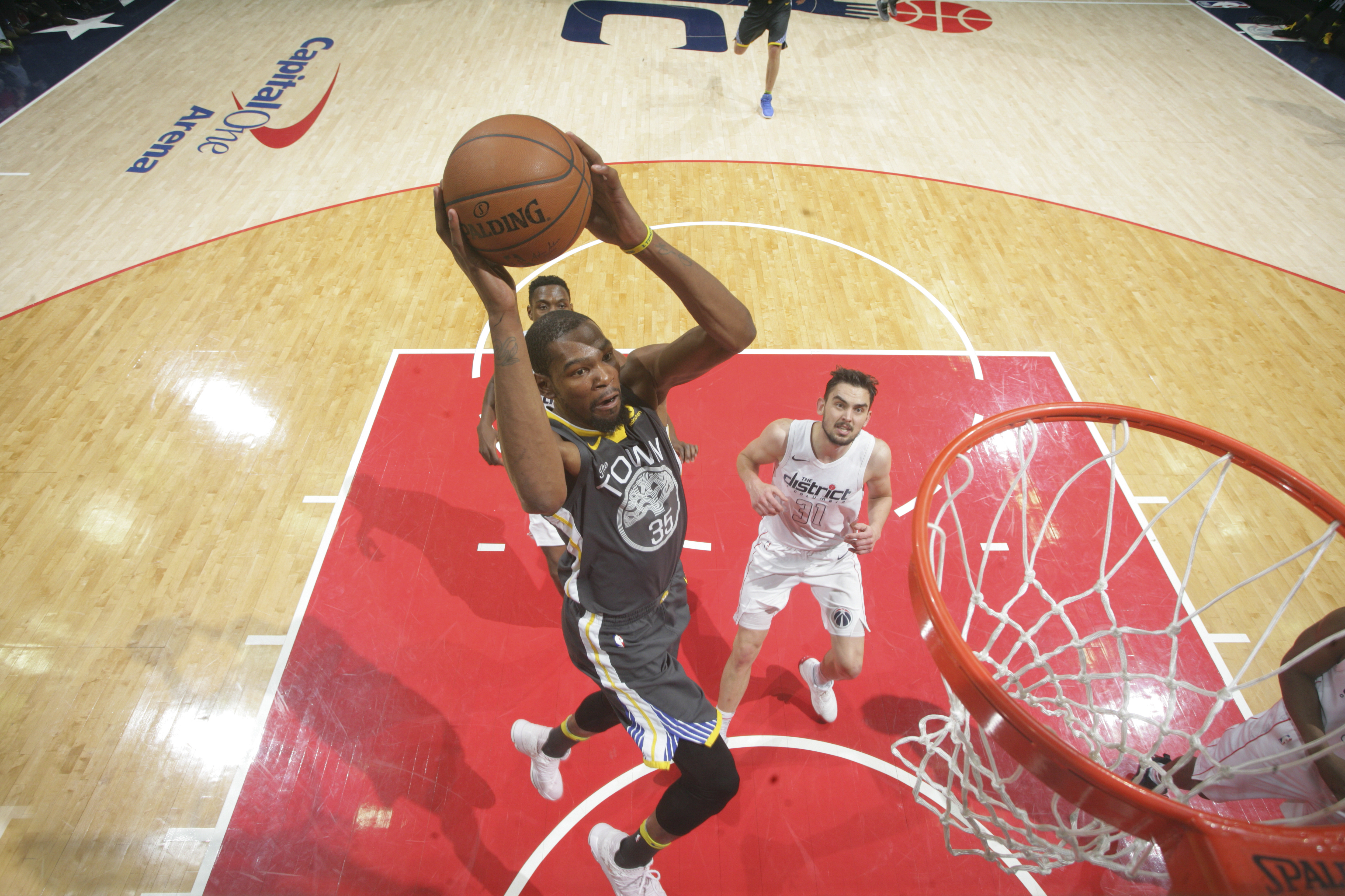 WASHINGTON, DC - FEBRUARY 28: Kevin Durant #35 of the Golden State Warriors dunks the ball against the Washington Wizards on February 28, 2018 at Capital One Arena in Washington, DC. NOTE TO USER: User expressly acknowledges and agrees that, by downloading and or using this Photograph, user is consenting to the terms and conditions of the Getty Images License Agreement. Mandatory Copyright Notice: Copyright 2018 NBAE (Photo by Ned Dishman/NBAE via Getty Images)
