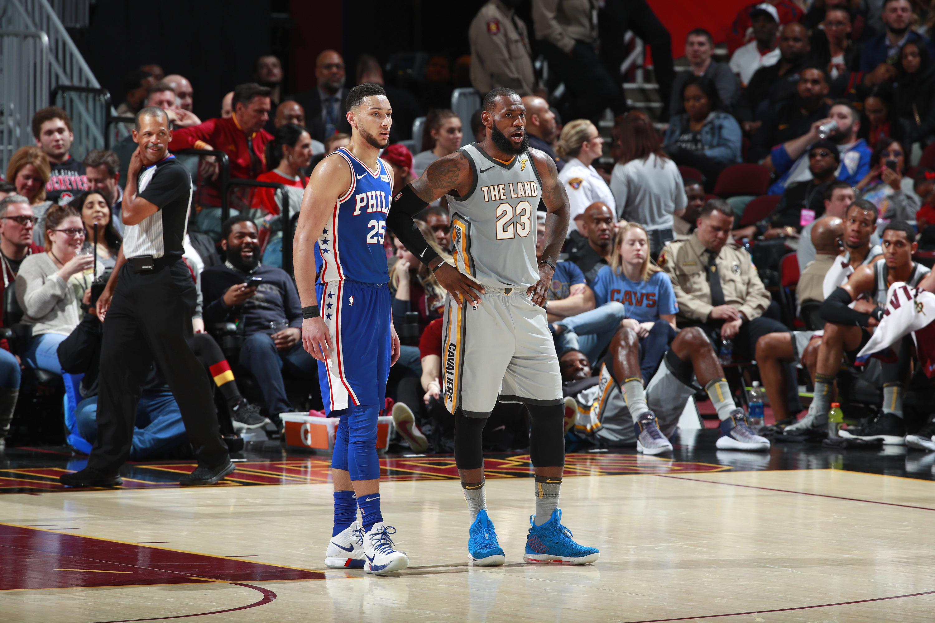 CLEVELAND, OH - MARCH 1: Ben Simmons #25 of the Philadelphia 76ers and LeBron James #23 of the Cleveland Cavaliers look on during the game on March 1, 2018 at Quicken Loans Arena in Cleveland, Ohio. NOTE TO USER: User expressly acknowledges and agrees that, by downloading and/or using this photograph, user is consenting to the terms and conditions of the Getty Images License Agreement. Mandatory Copyright Notice: Copyright 2018 NBAE (Photo by Jeff Haynes/NBAE via Getty Images)