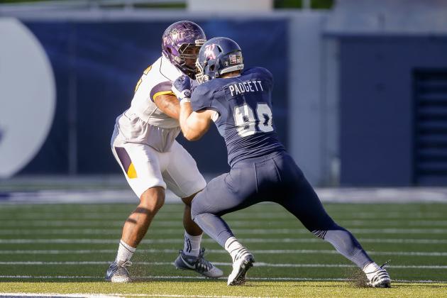 HOUSTON, TX - OCTOBER 22:Blain Padgett #90 of the Rice Owls and Josiah Freeman #56 of the Prairie View Am Panthers lock up at Rice Stadium on October 22, 2016 in Houston, Texas. (Photo by Bob Levey/Getty Images)