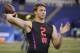 Wyoming quarterback Josh Allen runs a drill at the NFL football scouting combine in Indianapolis, Saturday, March 3, 2018. (AP Photo/Michael Conroy)