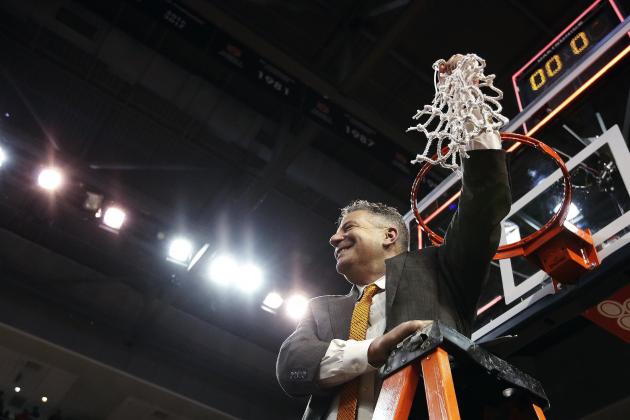 Auburn head coach Bruce Pearl cuts down the net after an NCAA college basketball game against South Carolina, Saturday, March 3, 2018, in Auburn, Ala. (AP Photo/Brynn Anderson)