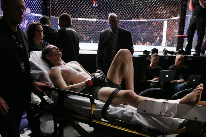 LAS VEGAS, NV - MARCH 03: Sean O'Malley leaves the arena on a stretcher after injuring his lower right leg during a bantamweight bout against Andre Soukhamthath during UFC 222 at T-Mobile Arena on March 3, 2018 in Las Vegas, Nevada. (Photo by Isaac Brekken/Getty Images)