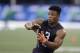 Penn State running back Saquon Barkley runs a drill during the NFL football scouting combine, Friday, March 2, 2018, in Indianapolis. (AP Photo/Darron Cummings)