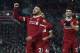 Liverpool's English midfielder Alex Oxlade-Chamberlain (L) celebrates scoring their fifth goal with Liverpool's English midfielder Trent Alexander-Arnold (C) and Liverpool's English striker Dominic Solanke (R) during the English Premier League football match between Liverpool and Swansea City at Anfield in Liverpool, north west England on December 26, 2017. / AFP PHOTO / PAUL ELLIS / RESTRICTED TO EDITORIAL USE. No use with unauthorized audio, video, data, fixture lists, club/league logos or 'live' services. Online in-match use limited to 75 images, no video emulation. No use in betting, games or single club/league/player publications. / (Photo credit should read PAUL ELLIS/AFP/Getty Images)