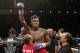Jermall Charlo celebrates after defeating Austin Trout in a junior middleweight title boxing bout Saturday, May 21, 2016, in Las Vegas. (AP Photo/John Locher)