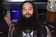NEW YORK, NY - MARCH 29: WWE Superstars Braun Strowman, Bray Wyatt and Erick Rowan ring The New York Stock Exchange Opening Bell in honor of WrestleMania 32 at New York Stock Exchange on March 29, 2016 in New York City. (Photo by Jamie McCarthy/Getty Images)