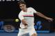 Switzerland's Roger Federer makes a forehand return to Tomas Berdych of the Czech Republic during their quarterfinal at the Australian Open tennis championships in Melbourne, Australia, Wednesday, Jan. 24, 2018. (AP Photo/Vincent Thian)