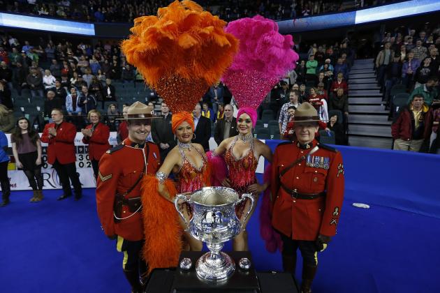 CALGARY, AB - MARCH 8: Las Vegas show girls pose with members of the Royal Canadian Mounted Police and the Tankard trophy at the gold medal game in curling during the Tim Horton's Brier at the Scotiabank Saddledome on March 8, 2015 in Calgary, Alberta, Canada. (Photo by Todd Korol/Getty Images)