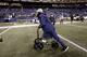 Injured Seattle Seahawks' Richard Sherman uses a scooter to roll off the field after an NFL football game by the Seahawks against the Philadelphia Eagles, Sunday, Dec. 3, 2017, in Seattle. (AP Photo/John Froschauer)
