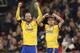 Juventus' Paulo Dybala, right, celebrates with his teammate Gonzalo Higuain after scoring his side second goal during the Champions League, round of 16, second-leg soccer match between Juventus and Tottenham Hotspur, at the Wembley Stadium in London, Wednesday, March 7, 2018. (AP Photo/Frank Augstein)