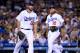LOS ANGELES, CA - MAY 01: Clayton Kershaw #22 and Justin Turner #10 of the Los Angeles Dodgers react to a Kershaw throwing error allowing Gorkys Hernandez #66 of the San Francisco Giants to reach base during the fourth inning at Dodger Stadium on May 1, 2017 in Los Angeles, California. (Photo by Harry How/Getty Images)
