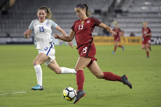 United States forward Alex Morgan (13) controls the ball in front of England defender Abby McManus (15) during the first half of a SheBelieves Cup women's soccer match Wednesday, March 7, 2018, in Orlando, Fla. (AP Photo/Phelan M. Ebenhack)