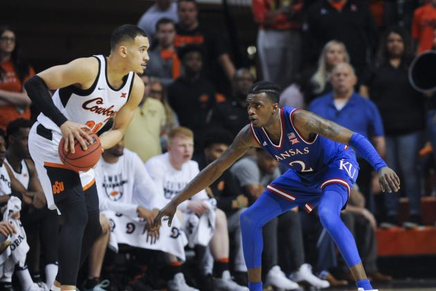 Kanasa forward Cameron McGriff defends against an advancing Oklahoma State forward Jeffrey Carroll during an NCAA college basketball game in Stillwater, Okla., Saturday, March. 3, 2018.(AP Photo/Brody Schmidt)