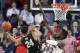 Colorado's George King (24) shoots as Arizona's Deandre Ayton defends during the first half of an NCAA college basketball game in the quarterfinals of the Pac-12 men's tournament Thursday, March 8, 2018, in Las Vegas. (AP Photo/Isaac Brekken)