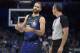 Orlando Magic guard Evan Fournier (10) talks with official J.T. Orr, right, during the first half of an NBA basketball game against the Memphis Grizzlies Saturday, March 3, 2018, in Orlando, Fla. (AP Photo/Phelan M. Ebenhack)