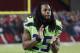 Seattle Seahawks cornerback Richard Sherman (25) stands on the sidelines after being injured against the Arizona Cardinals during the second half of an NFL football game, Thursday, Nov. 9, 2017, in Glendale, Ariz. (AP Photo/Rick Scuteri)