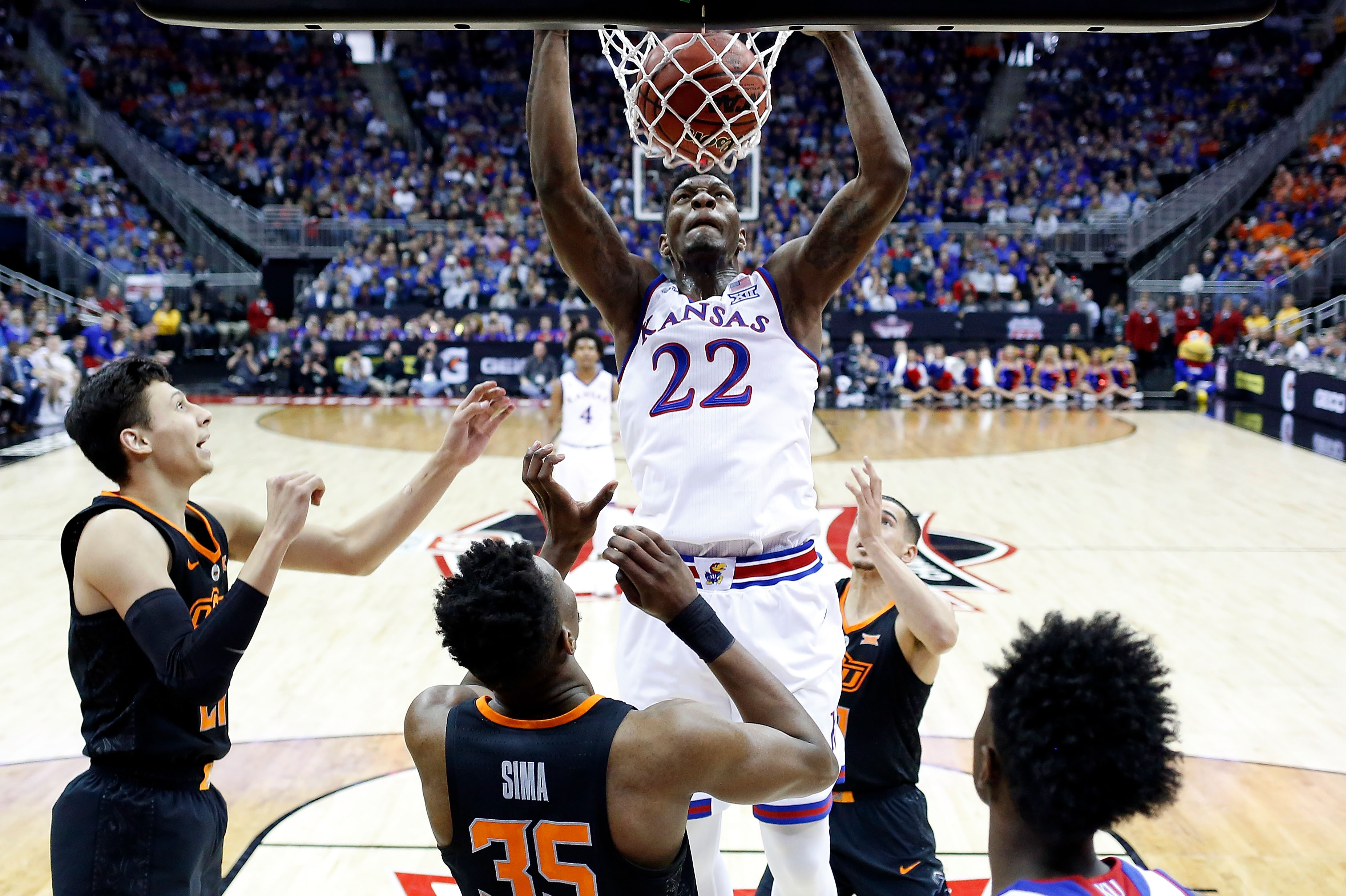 KANSAS CITY, MO - MARCH 08: Silvio De Sousa #22 of the Kansas Jayhawks dunks during the Big 12 Basketball Tournament quarterfinal game against the Oklahoma State Cowboys at the Sprint Center on March 8, 2018 in Kansas City, Missouri. (Photo by Jamie Squire/Getty Images)