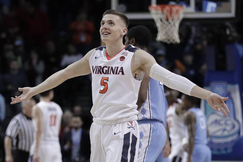 Virginia guard Kyle Guy (5) celebrates as the final seconds wind off the clock against North Carolina in the championship game of an NCAA college basketball game during the Atlantic Coast Conference men's tournament Saturday, March 10, 2018, in New York. (AP Photo/Julie Jacobson)
