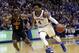 FILE - In this Feb. 3, 2018, file photo, Kansas guard Devonte Graham (4) drives past Oklahoma State guard Brandon Averette (0) during the first half of an NCAA college basketball game in Lawrence, Kan. Graham wanted a team to call his own at Kansas, and didn’t want to be responsible for the end of a Big 12 regular-season championship streak that now covers all but the first of coach Bill Self’s 15 seasons. The senior guard accomplished both, despite some doubts along the way. Now Graham will try to get the sixth-ranked Jayhawks to the Final Four after predecessor Frank Mason III came up a game short the past two years. (AP Photo/Orlin Wagner, File)