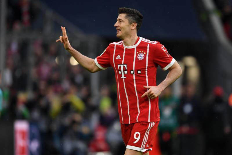 MUNICH, GERMANY - MARCH 10: Robert Lewandowski of Bayern Munich celebrates scoring his side's sixth and hat trick goal during the Bundesliga match between FC Bayern Muenchen and Hamburger SV at Allianz Arena on March 10, 2018 in Munich, Germany. (Photo by Etsuo Hara/Getty Images)