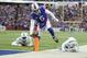 Buffalo Bills quarterback Tyrod Taylor (5) rushes past Miami Dolphins' Stephone Anthony (44) and Reshad Jones (20) for a touchdown during the first half of an NFL football game Sunday, Dec. 17, 2017, in Orchard Park, N.Y. (AP Photo/Adrian Kraus)