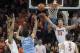 FILE - In this Jan. 6, 2018, file photo, Virginia's Jack Salt (33), Isaiah Wilkins, left, and Kyle Guy contest a shot by North Carolina's Luke Maye (32) during first half of an NCAA college basketball game in Charlottesville, Va. The Cavaliers lead the nation in scoring defense, allowing 52.7 points per game. (AP Photo/ Lee Luther Jr., File)