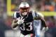 FOXBOROUGH, MA - JANUARY 13: Dion Lewis #33 of the New England Patriots carries the ball in the second quarter of the AFC Divisional Playoff game against the Tennessee Titans at Gillette Stadium on January 13, 2018 in Foxborough, Massachusetts. (Photo by Elsa/Getty Images)