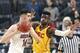 Arizona's Dusan Ristic, left, looks to pass the ball as Southern California's Chimezie Metu defends during the first half of an NCAA college basketball game in the Pac-12 men's tournament final Saturday, March 10, 2018, in Las Vegas. (AP Photo/Isaac Brekken)