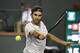Roger Federer, of Switzerland, returns a shot against Chung Hyeon, of South Korea, during the quarterfinals at the BNP Paribas Open tennis tournament, Thursday, March 15, 2018, in Indian Wells, Calif. (AP Photo/Mark J. Terrill)