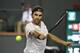 Roger Federer, of Switzerland, returns a shot against Chung Hyeon, of South Korea, during the quarterfinals at the BNP Paribas Open tennis tournament, Thursday, March 15, 2018, in Indian Wells, Calif. (AP Photo/Mark J. Terrill)