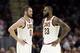 Cleveland Cavaliers' Kevin Love (0) talks with LeBron James (23) in the first half of an NBA basketball game against the Orlando Magic, Saturday, Oct. 21, 2017, in Cleveland. (AP Photo/Tony Dejak)