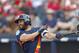 Houston Astros second baseman Jose Altuve (27) bats during a spring training baseball game against the Washington Nationals Tuesday, March 6, 2018, in West Palm Beach, Fla. (AP Photo/John Bazemore)