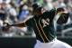 Oakland Athletics starting pitcher Jharel Cotton throws against the San Francisco Giants during the first inning of a spring baseball game in Mesa, Ariz., Monday, March 12, 2018. (AP Photo/Chris Carlson)