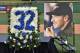 A photo of former Toronto Blue Jays pitcher Roy Halladay and a floral arrangement of his Toronto jersey number are on display during a memorial tribute for Halladay at the Philadelphia Phillies spring training baseball stadium, Tuesday, Nov. 14, 2017, in Clearwater, Fla. (AP Photo/Steve Nesius)