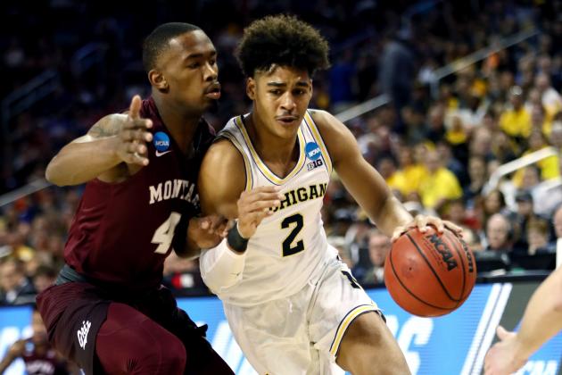 WICHITA, KS - MARCH 15: Jordan Poole #2 of the Michigan Wolverines is defended by Sayeed Pridgett #4 of the Montana Grizzlies during the first half of the first round of the 2018 NCAA Men's Basketball Tournament at INTRUST Arena on March 15, 2018 in Wichita, Kansas.  (Photo by Jamie Squire/Getty Images)