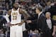 Cleveland Cavaliers head coach Tyronn Lue talks with LeBron James during the second half of an NBA basketball game against the Indiana Pacers, Friday, Jan. 12, 2018, in Indianapolis. Indiana won 97-95. (AP Photo/Darron Cummings)