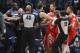 Minnesota Timberwolves center Gorgui Dieng (5) and Houston Rockets forward Gerald Green (14) are restrained in the fourth quarter of an NBA basketball game Sunday, March 18, 2018, in Minneapolis. Green was ejected on the play as the Rockets defeated the Timberwolves 129-120. (AP Photo/Andy Clayton-King)
