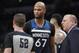 Minnesota Timberwolves forward Taj Gibson (67) glares at referee Scott Twardoski (52) after being called for a foul during the first half of an NBA basketball game against the San Antonio Spurs, Saturday, March 17, 2018, in San Antonio. San Antonio won 117-101. (AP Photo/Darren Abate)