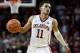 FILE - In this Feb. 17, 2018, file photo, Oklahoma guard Trae Young (11) brings the ball upcourt during the second half of an NCAA college basketball game against Texas in Norman, Okla. Young leads the country in both scoring and assists entering the final weekend of the regular season. (AP Photo/Sue Ogrocki, File)