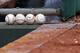 PHILADELPHIA, PA - JULY 23: Four baseballs sit on a ledge in the visitors dugout before a game between the Philadelphia Phillies and the Milwaukee Brewers at Citizens Bank Park on July 23, 2017 in Philadelphia, Pennsylvania. The Phillies won 6-3. (Photo by Hunter Martin/Getty Images) *** Local Caption ***