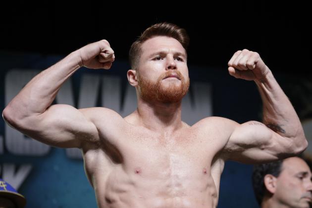 Canelo Alvarez poses on the scale during a weigh-in Friday, Sept. 15, 2017, in Las Vegas. Alvarez is scheduled to fight Gennady Golovkin in a middleweight title fight Saturday in Las Vegas. (AP Photo/John Locher)
