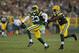 Green Bay Packers cornerback Damarious Randall (23), left, celebrates an interception with teammate Green Bay Datone Jones (95)during the first half of an NFL preseason football game against the Oakland Raiders in Green Bay, Wis., Thursday, Aug. 18, 2016. (AP Photo/Matt Ludtke)