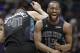 Charlotte Hornets' Kemba Walker (15) celebrates with Willy Hernangomez (41) during the second half of an NBA basketball game against the Memphis Grizzlies in Charlotte, N.C., Thursday, March 22, 2018. (AP Photo/Chuck Burton)
