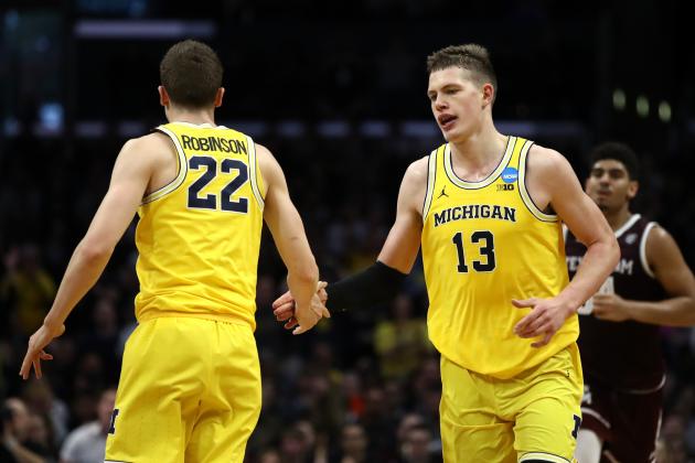 LOS ANGELES, CA - MARCH 22: Duncan Robinson #22 and Moritz Wagner #13 of the Michigan Wolverines celebrate the play against the Texas A&M Aggies during the first half in the 2018 NCAA Men's Basketball Tournament West Regional at Staples Center on March 22, 2018 in Los Angeles, California.  (Photo by Ezra Shaw/Getty Images)