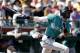 Seattle Mariners' Dee Gordon watches his two run home run against the San Francisco Giants during the third inning of a spring baseball game in Scottsdale, Ariz., Friday, March 9, 2018. (AP Photo/Chris Carlson)