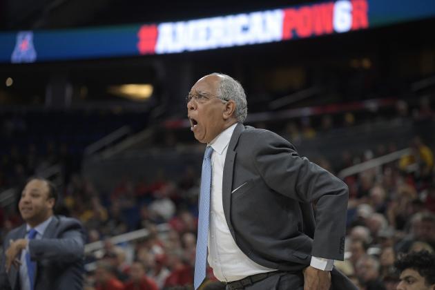 Memphis head coach Tubby Smith, right, and assistant coach Saul Smith call out instructions during the first half of an NCAA college basketball semifinal game against Cincinnati at the American Athletic Conference tournament Saturday, March 10, 2018, in Orlando, Fla. (AP Photo/Phelan M. Ebenhack)